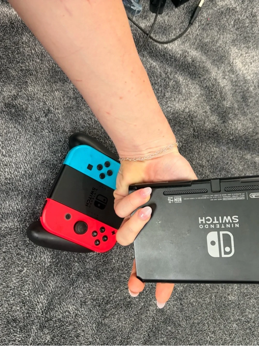Nintendo Switch with Red & Blue Joy-Con Controllers + hand held controller